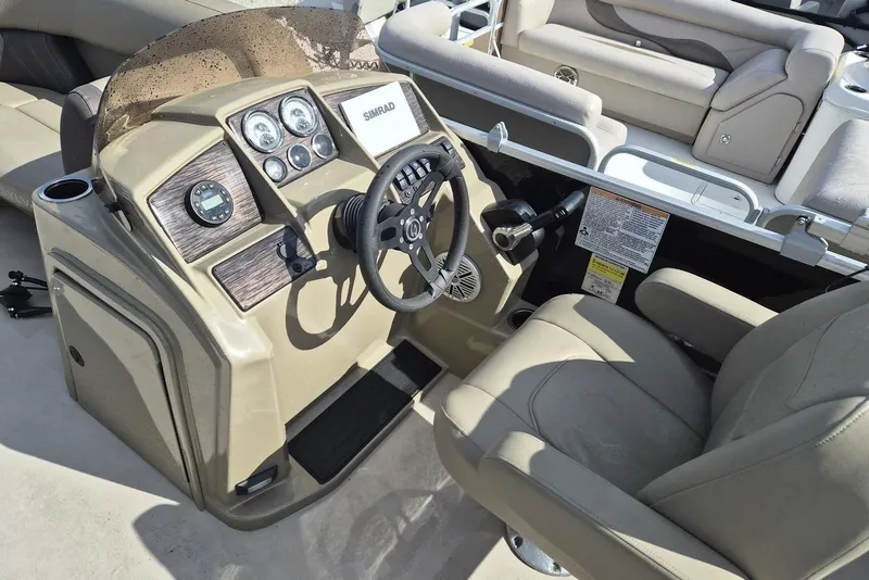 Slide: The Image of 2022 Sylvan Mirage Fish 820 Party Fish boat interior with steering console and seating. - 8