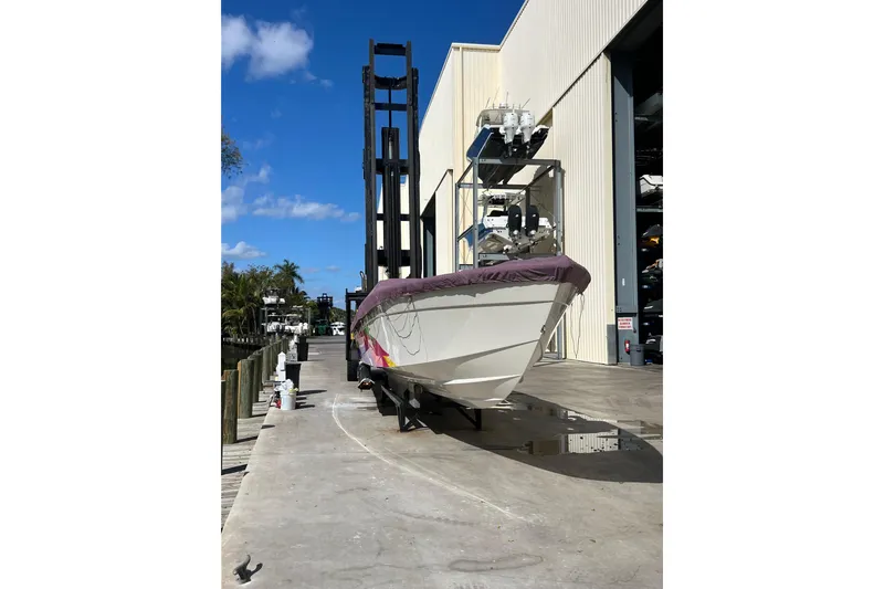 Slide: The Image of 1997 Powerplay Powerboats 33 Sport Deck on dock, sunny day, marina background. - 6