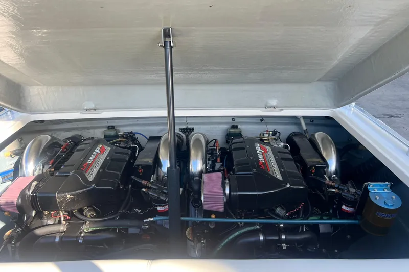 Slide: The Image of 1997 Powerplay Powerboats 33 Sport Deck engine compartment with dual high-performance engines. - 8