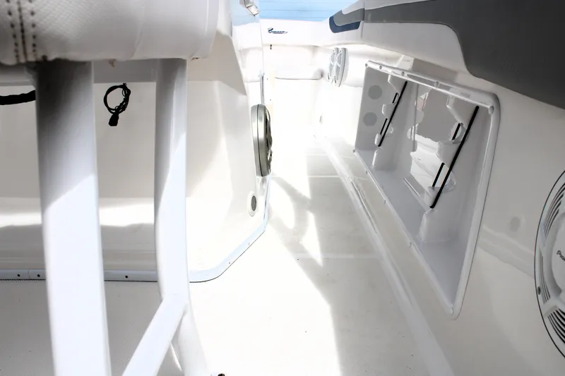 Slide: The Image of Interior view of a 2007 Renegade 29CC boat, showcasing storage compartments and seating. - 21