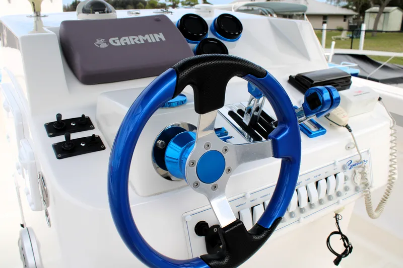 Slide: The Image of Steering console of a 2007 Renegade 29CC boat with Garmin navigation system. - 24