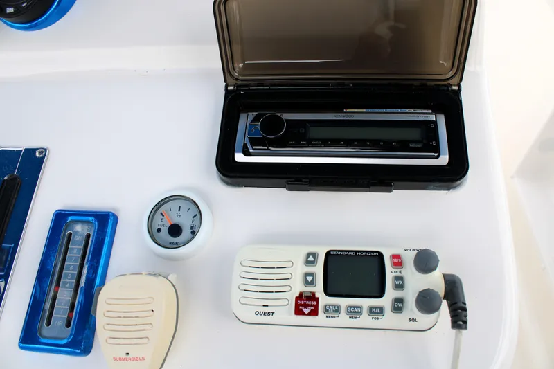 Slide: The Image of Control panel of a 2007 Renegade 29CC boat with radio and gauges. - 26