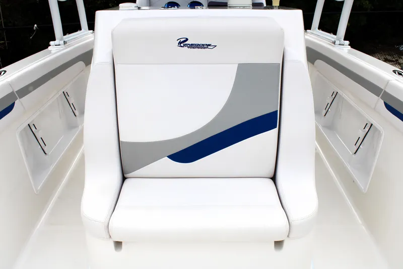 Slide: The Image of White and gray seating on 2007 Renegade 29CC boat, featuring sleek design and logo. - 30