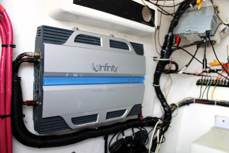 Slide: The Image of Infinity amplifier installed in a 2007 Renegade 29CC boat, showcasing marine audio setup. - 36