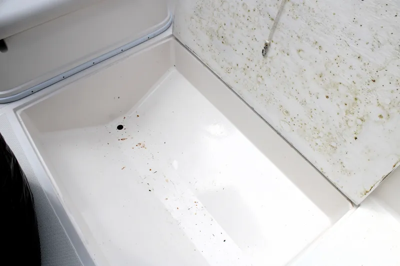 Slide: The Image of Clean storage compartment of 2007 Renegade 29CC boat with some dirt and stains. - 38