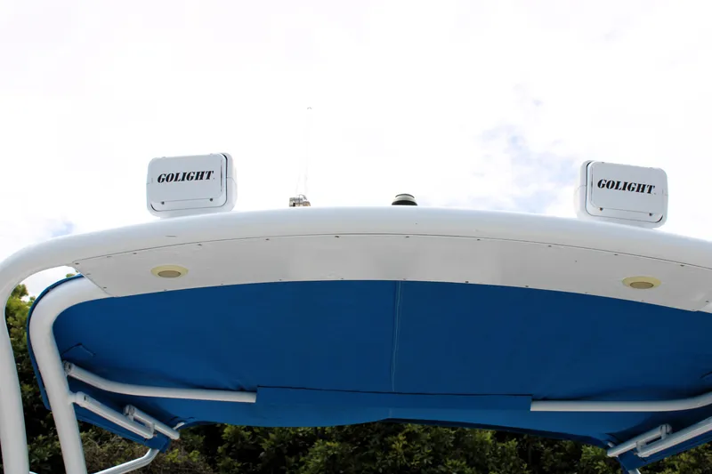 Slide: The Image of 2007 Renegade 29CC boat with Golight fixtures and blue canopy. - 44