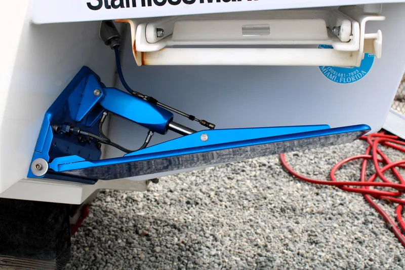 Slide: The Image of Close-up of a 2007 Renegade 29CC boat trim tab mechanism in blue. - 48