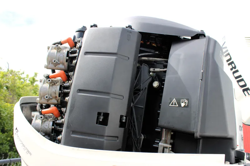 Slide: The Image of 2007 Renegade 29CC outboard engine with visible components and warning labels. - 51