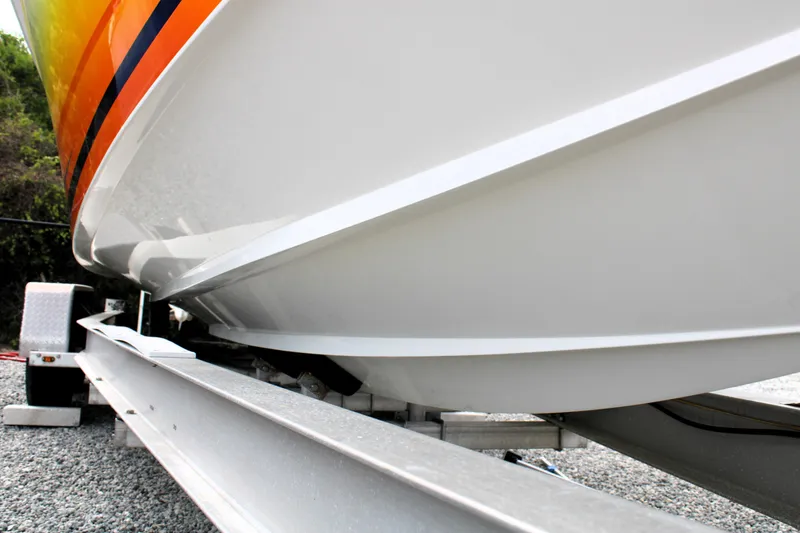 Slide: The Image of 2007 Renegade 29CC boat on trailer, showcasing sleek hull design. - 56