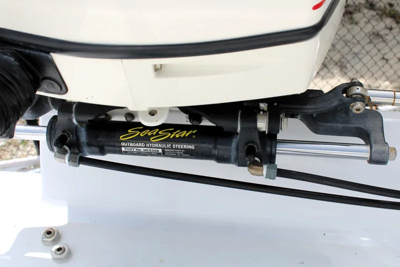 Slide: The Image of SeaStar outboard hydraulic steering on 2007 Renegade 29CC boat. - 7