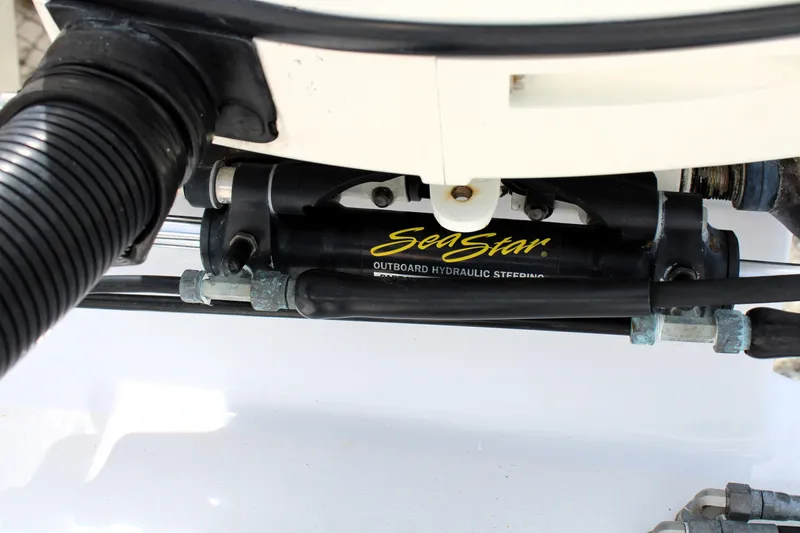 Slide: The Image of SeaStar outboard hydraulic steering system on a 2007 Renegade 29CC boat. - 8