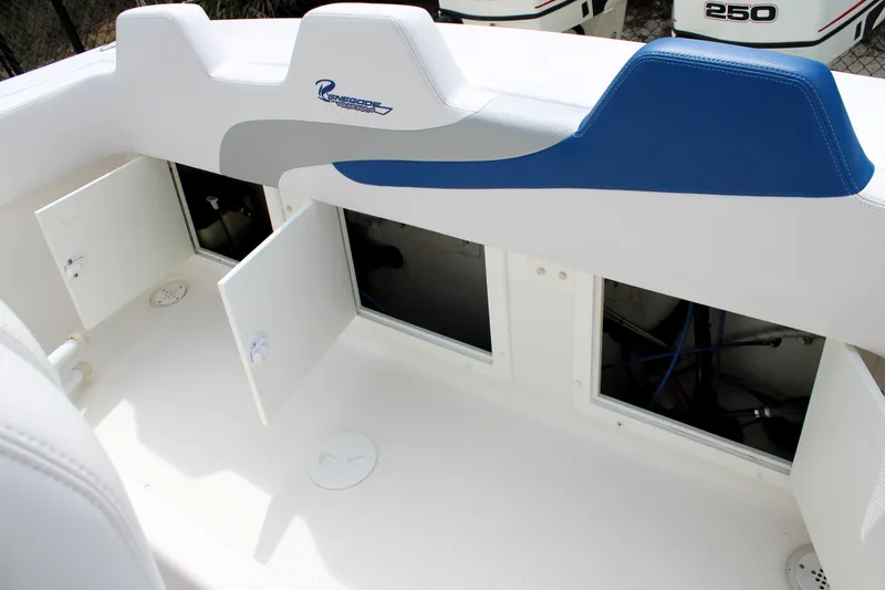 Slide: The Image of Interior view of a 2007 Renegade 29CC boat, featuring open storage compartments. - 9