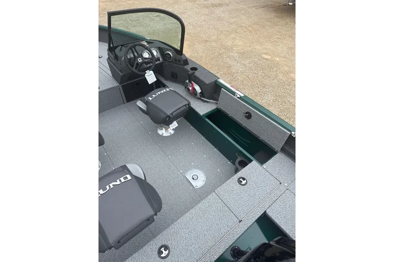 Slide: The Image of 2026 Lund 1700 Explorer Sport boat interior with seating and steering console. - 10