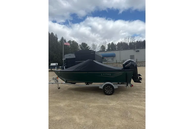 Slide: The Image of 2026 Lund 1700 Explorer Sport boat on trailer, covered, with Mercury outboard motor. - 15