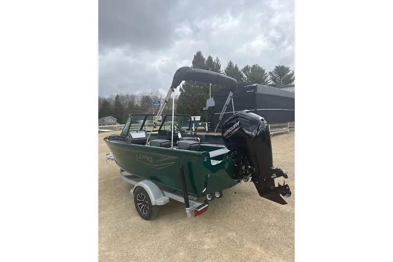 Slide: The Image of 2026 Lund 1700 Explorer Sport boat with Mercury outboard motor on a trailer. - 3