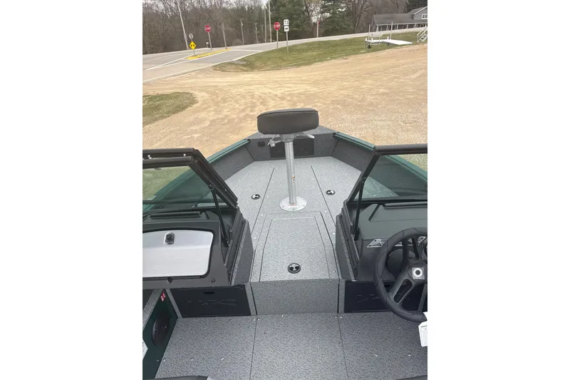 Slide: The Image of 2026 Lund 1700 Explorer Sport boat interior with seating and steering wheel. - 5