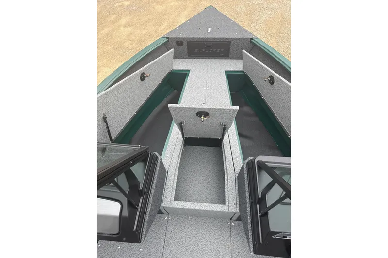 Slide: The Image of 2026 Lund 1700 Explorer Sport boat interior with open storage compartments. - 6