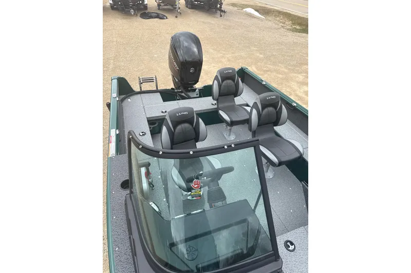 Slide: The Image of 2026 Lund 1700 Explorer Sport boat interior with seating and windshield view. - 8