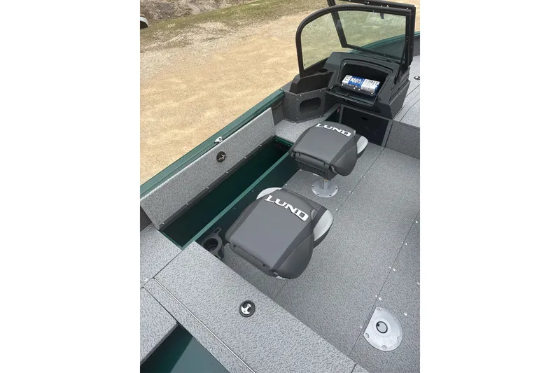 Slide: The Image of 2026 Lund 1700 Explorer Sport boat interior with seating and dashboard view. - 9