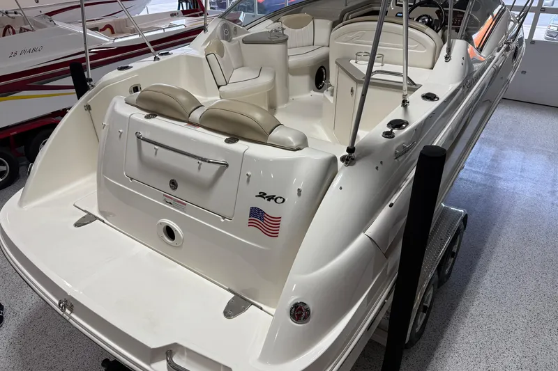 Slide: The Image of 2009 Sea Ray 240 Sundancer boat interior with seating and control panel. - 9