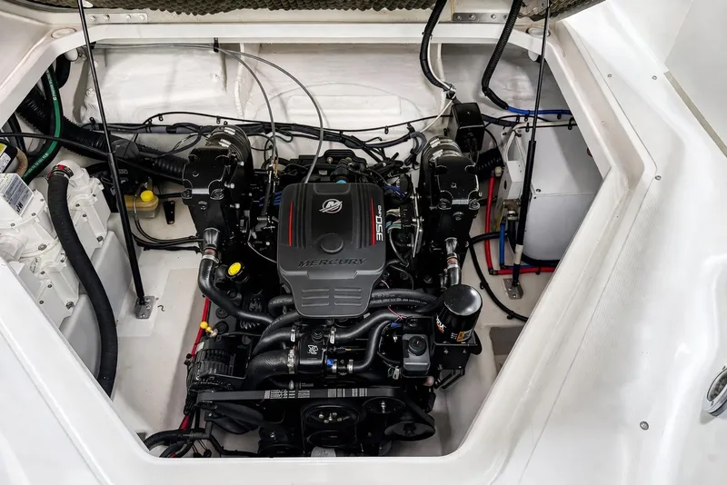 Slide: The Image of Engine compartment of a 2009 Sea Ray 240 Sundancer boat, featuring a Mercury 350 engine. - 30