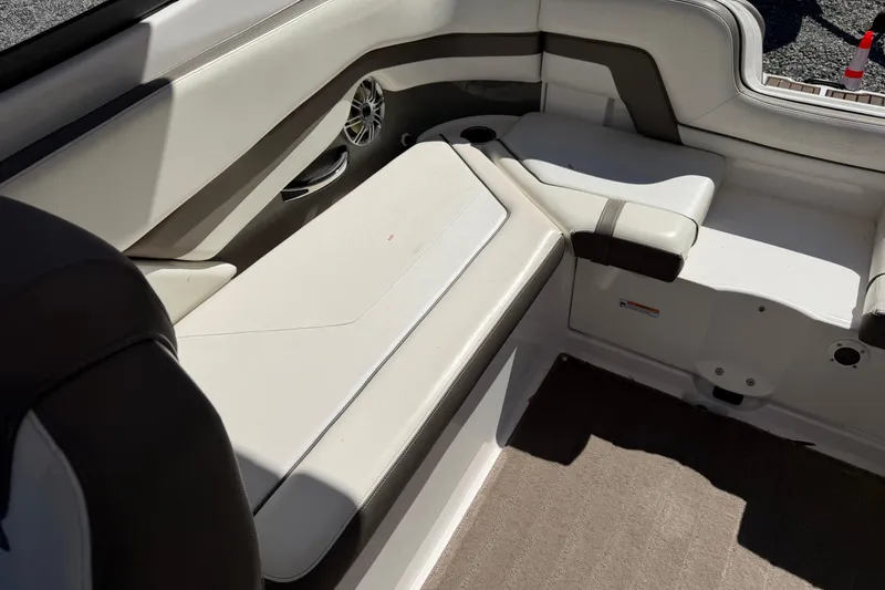 Slide: The Image of Interior seating of a 2016 Yamaha Boats 242 Limited S, featuring beige upholstery. - 15