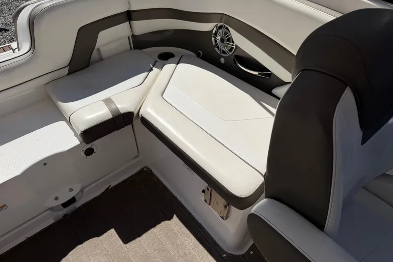 Slide: The Image of Interior seating of 2016 Yamaha Boats 242 Limited S, featuring sleek white and gray upholstery. - 17