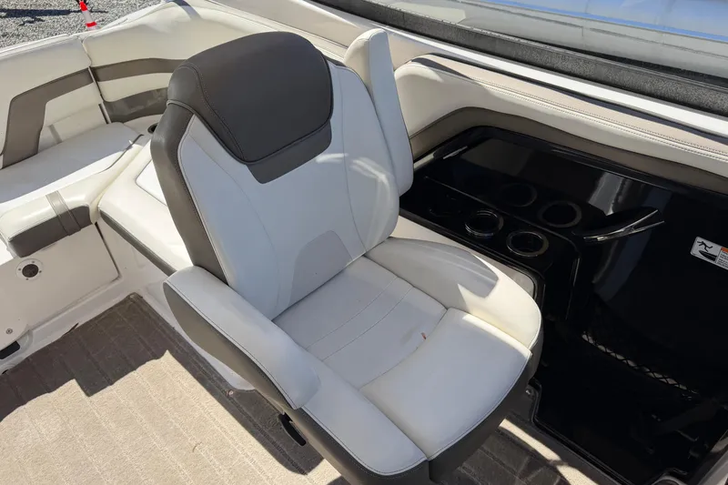 Slide: The Image of 2016 Yamaha Boats 242 Limited S interior with white and gray seating. - 18