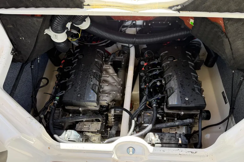 Slide: The Image of 2016 Yamaha Boats 242 Limited S engine compartment with dual engines visible. - 21