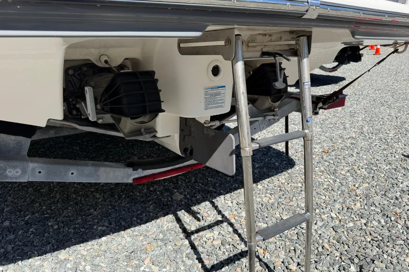 Slide: The Image of 2016 Yamaha Boats 242 Limited S rear view with ladder and jet propulsion system. - 23