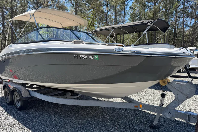 Slide: The Image of 2016 Yamaha Boats 242 Limited S on trailer, parked outdoors. - 4