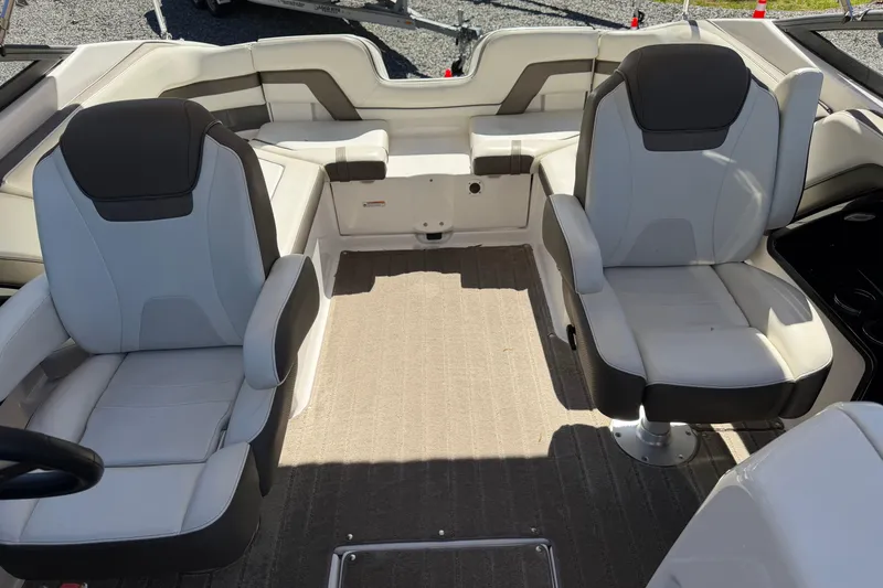 Slide: The Image of Interior of 2016 Yamaha Boats 242 Limited S, featuring two plush captain's chairs. - 7