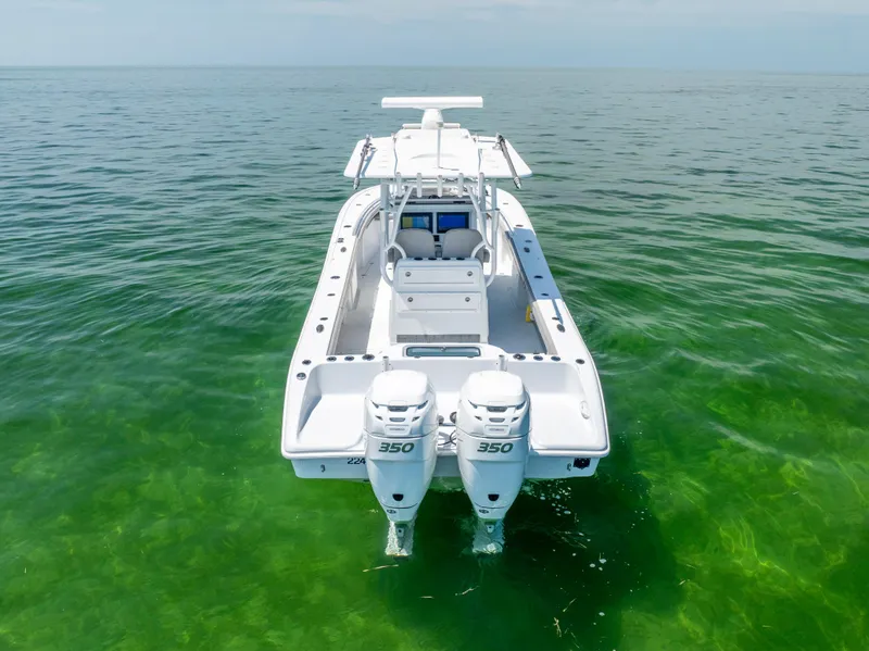 Slide: The Image of 2018 Yellowfin 32 Offshore boat on calm water. - 10