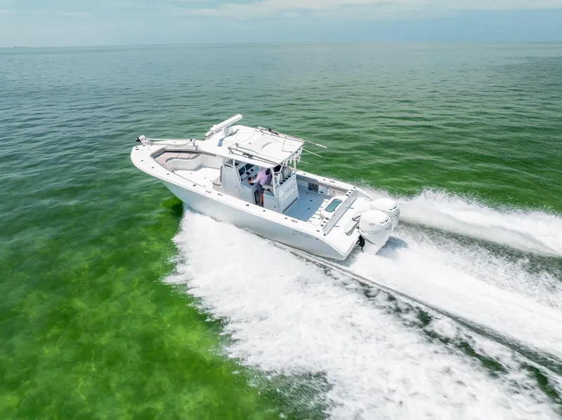 Slide: The Image of 2018 Yellowfin 32 Offshore boat on green water. - 11