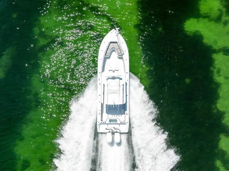 Slide: The Image of Aerial view of 2018 Yellowfin 32 Offshore boat on green water. - 13