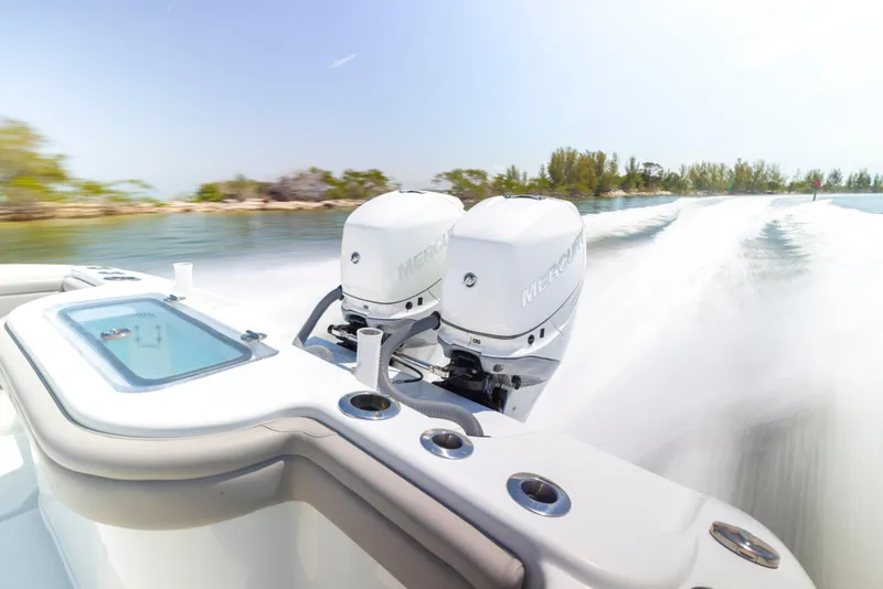 Slide: The Image of 2018 Yellowfin 32 Offshore with dual outboard motors on the water. - 14