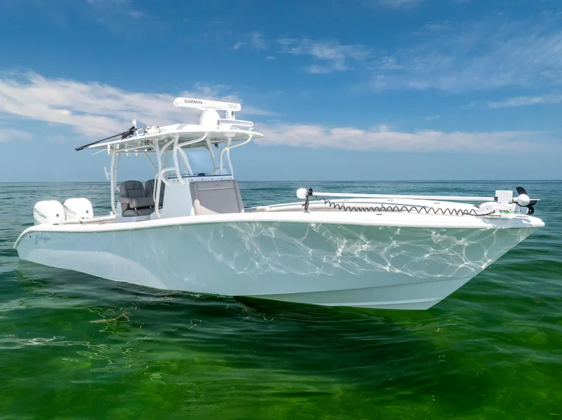 Slide: The Image of 2018 Yellowfin 32 Offshore boat on calm water. - 2