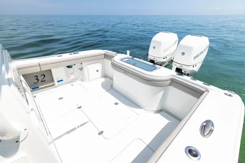 Slide: The Image of 2018 Yellowfin 32 Offshore boat with twin Mercury engines on open sea. - 22