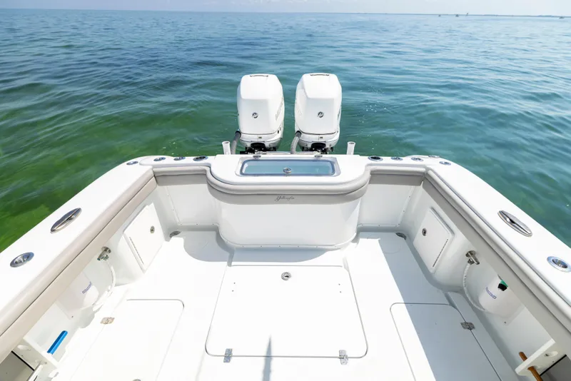 Slide: The Image of Interior view of a 2018 Yellowfin 32 Offshore boat on the water. - 24