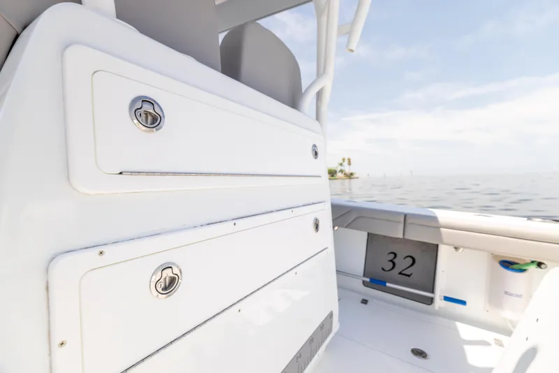 Slide: The Image of 2018 Yellowfin 32 Offshore boat interior with storage compartments. - 29