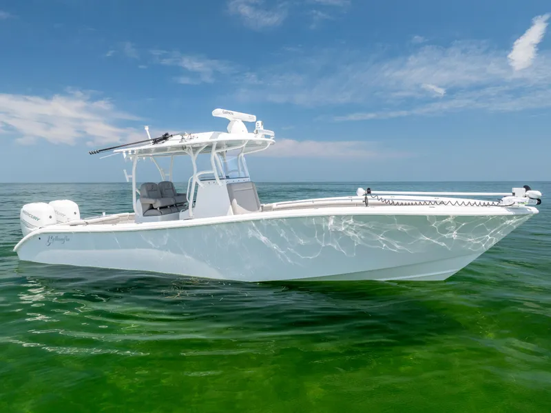 Slide: The Image of 2018 Yellowfin 32 Offshore boat on calm water. - 3