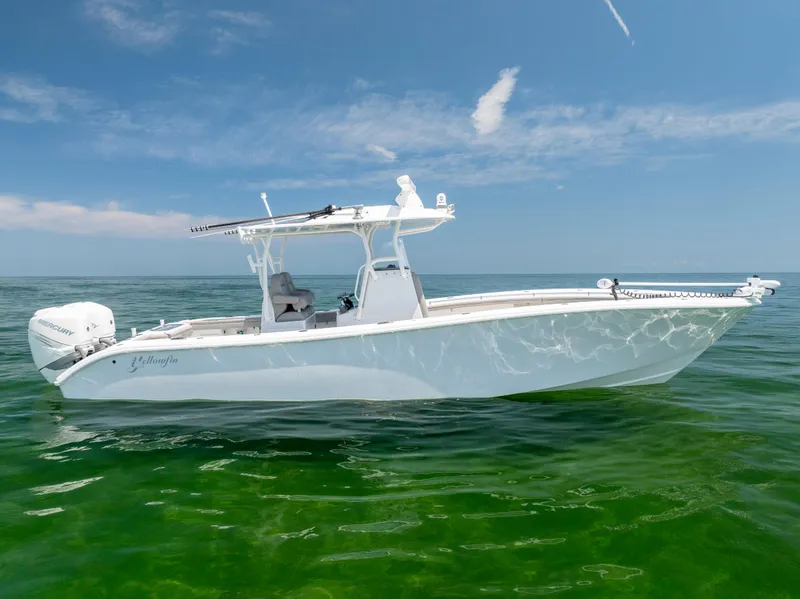 Slide: The Image of 2018 Yellowfin 32 Offshore boat on calm water. - 4