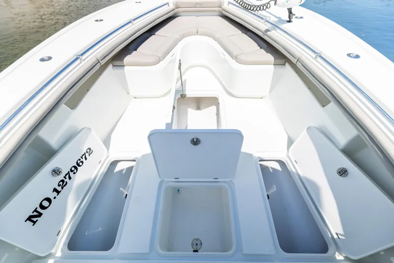 Slide: The Image of 2018 Yellowfin 32 Offshore boat with storage and seating area. - 46