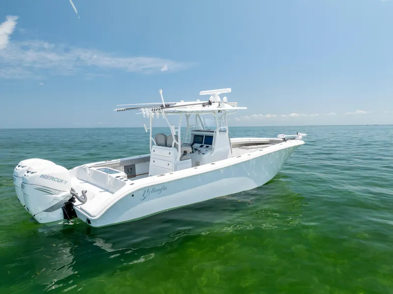 Slide: The Image of 2018 Yellowfin 32 Offshore boat on calm water. - 5