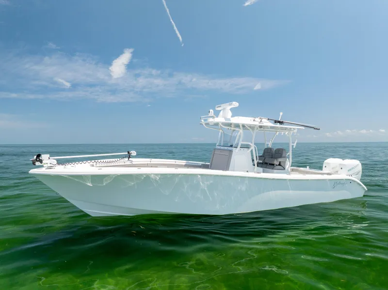 Slide: The Image of 2018 Yellowfin 32 Offshore boat on calm water. - 7