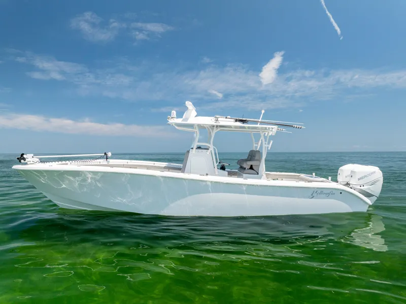 Slide: The Image of 2018 Yellowfin 32 Offshore boat on calm water. - 8