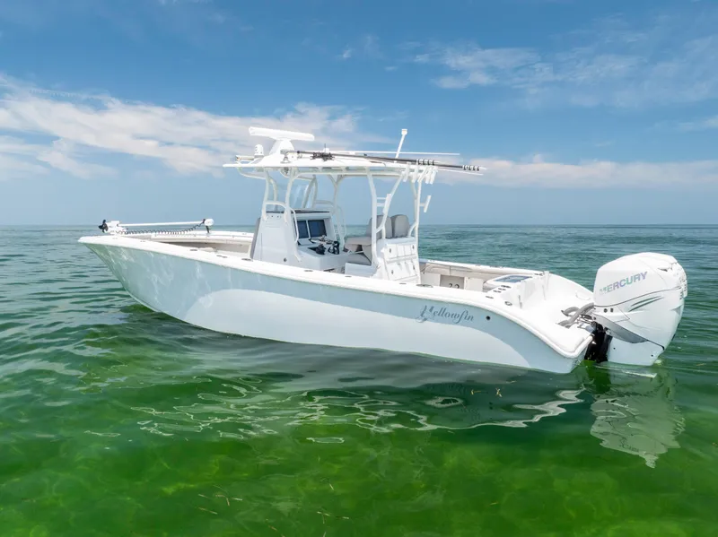 Slide: The Image of 2018 Yellowfin 32 Offshore boat on calm water. - 9