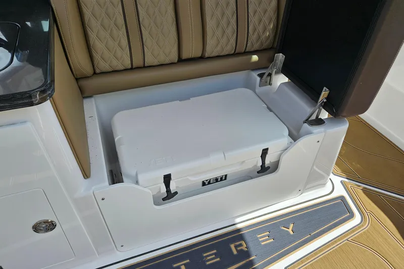 Slide: The Image of Luxury seating with integrated Yeti cooler on 2026 Monterey Elite 30 OB boat. - 13