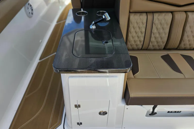 Slide: The Image of Luxury seating and console on 2026 Monterey Elite 30 OB boat, featuring elegant design and craftsmanship. - 14