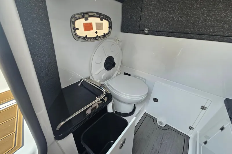 Slide: The Image of Interior of 2026 Monterey Elite 30 OB boat bathroom with modern fixtures. - 26